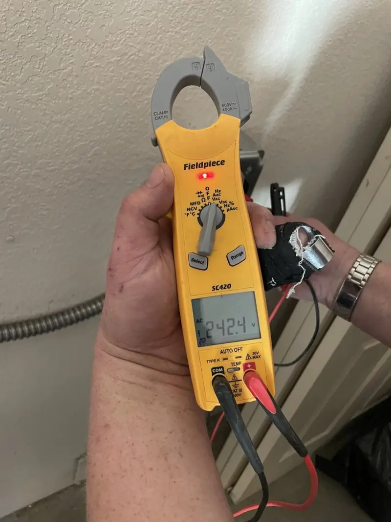 Voltage testing with clamp meter during Circuit Breaker Repair in Avondale